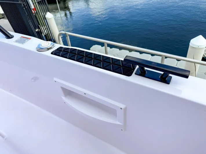  Yacht Photos Pics 2025 Axopar 37XC CROSS CABIN BRABUS Trim boat detail by the water.