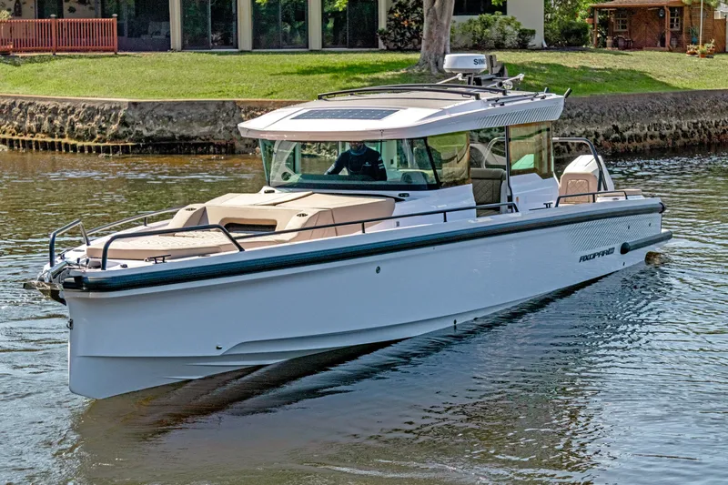  Yacht Photos Pics 2025 Axopar 37XC CROSS CABIN BRABUS Trim boat cruising on a calm river.