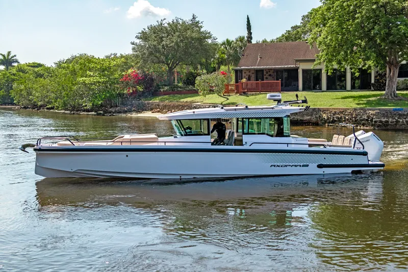  Yacht Photos Pics 2025 Axopar 37XC CROSS CABIN BRABUS Trim boat on a scenic river.