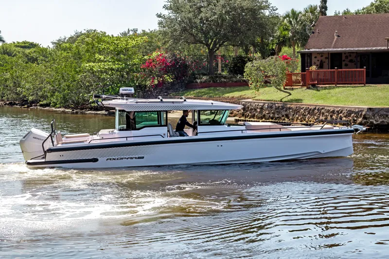  Yacht Photos Pics 2025 Axopar 37XC CROSS CABIN BRABUS Trim cruising on a scenic waterway.