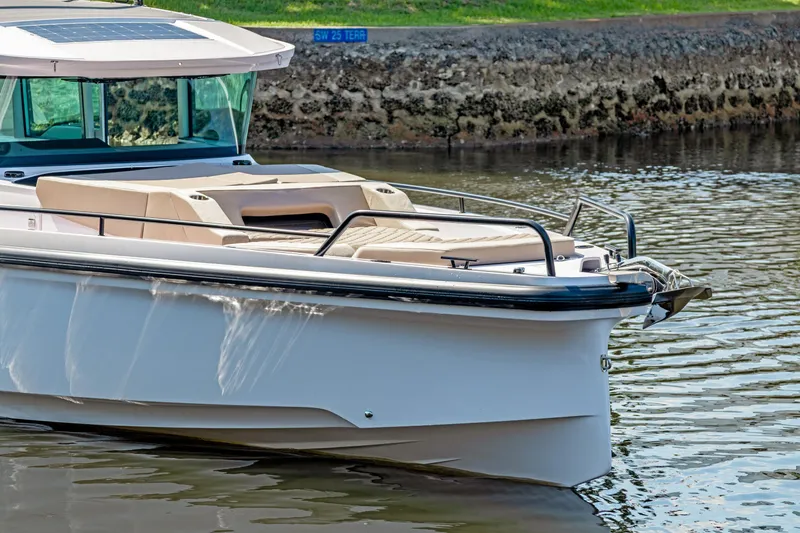  Yacht Photos Pics 2025 Axopar 37XC CROSS CABIN BRABUS Trim boat on calm water.