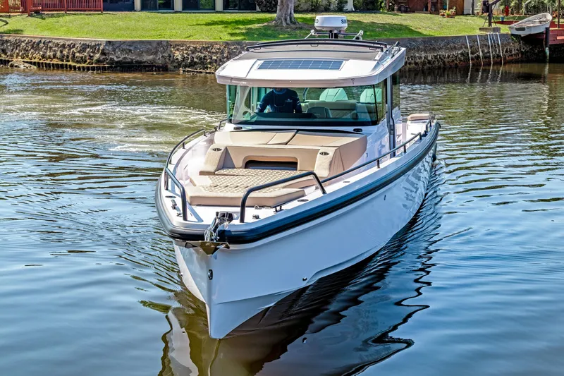  Yacht Photos Pics 2025 Axopar 37XC CROSS CABIN BRABUS Trim boat on calm water.