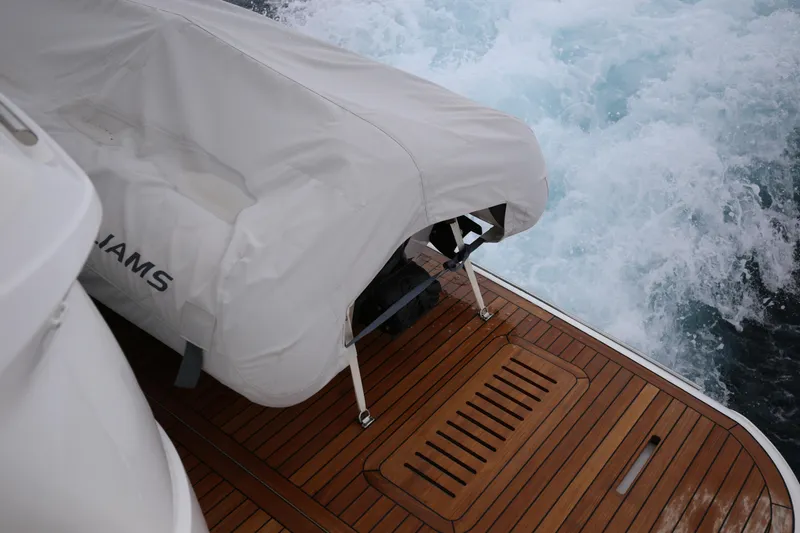  Yacht Photos Pics Covered equipment on Princess F55 yacht deck, 2025 model, with ocean waves in background.