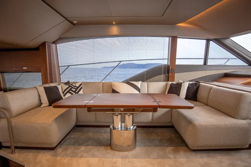  Yacht Photos Pics Luxurious interior of 2025 Princess F55 yacht with elegant seating and ocean view.