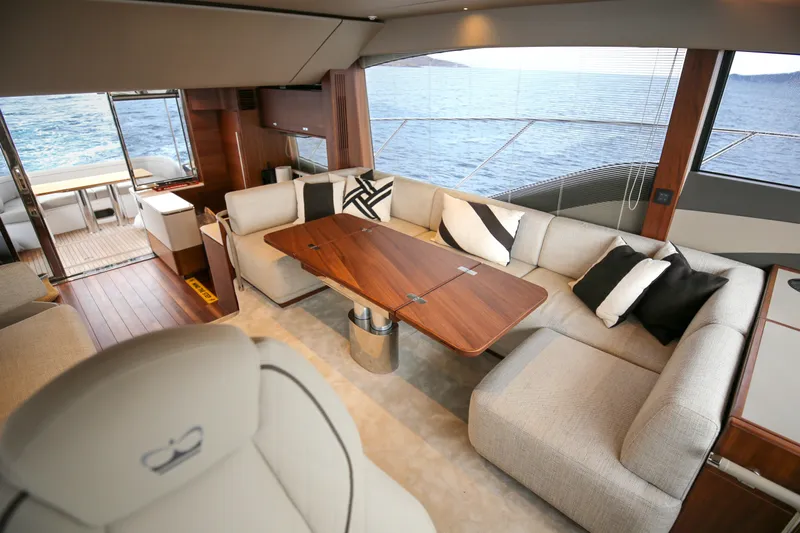  Yacht Photos Pics Luxurious interior of 2025 Princess F55 yacht with elegant seating and ocean view.