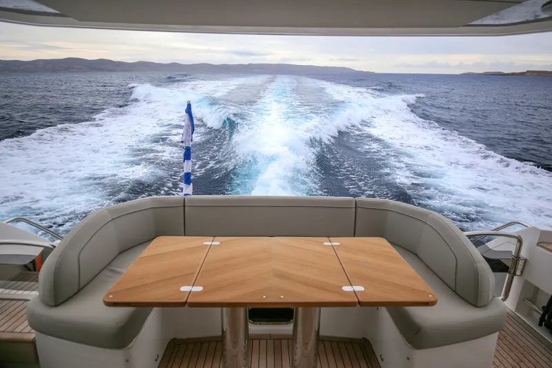  Yacht Photos Pics Luxury yacht Princess F55 cruising, showcasing elegant deck seating and ocean view, 2025 model.