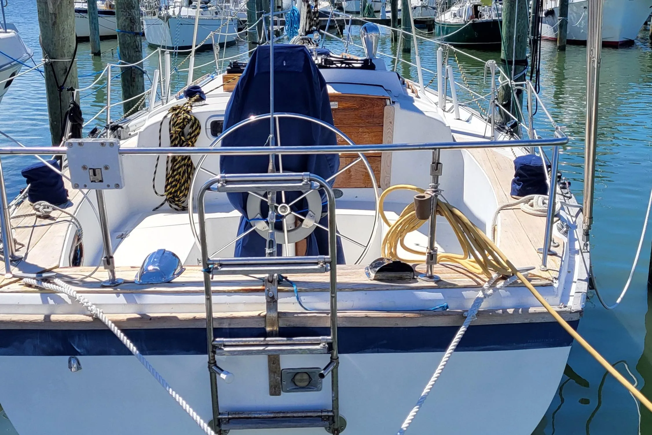 1979 Pearson 365 Sloop sailboat docked, featuring a spacious cockpit and nautical equipment.