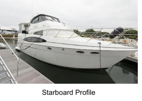  Yacht Photos Pics 2000 Carver 506 Motor Yacht, starboard view, docked in marina.