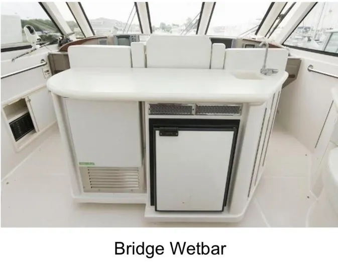  Yacht Photos Pics Bridge wet bar on 2000 Carver 506 Motor Yacht, featuring sleek design and modern amenities.