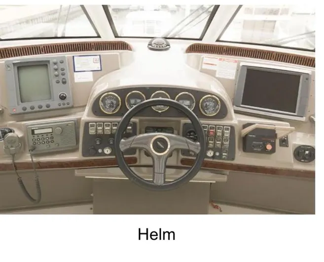 Yacht Photos Pics Helm of 2000 Carver 506 Motor Yacht with navigation instruments and steering wheel.