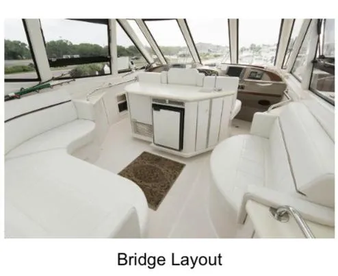  Yacht Photos Pics Bridge layout of 2000 Carver 506 Motor Yacht with white seating and helm.
