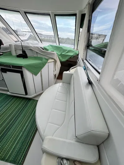 Yacht Photos Pics Interior of 2000 Carver 506 Motor Yacht with white seating and green accents.