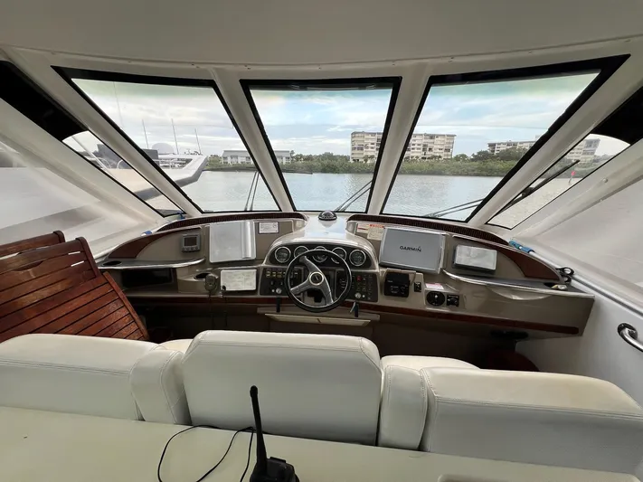  Yacht Photos Pics Interior view of 2000 Carver 506 Motor Yacht helm with navigation equipment and panoramic windows.