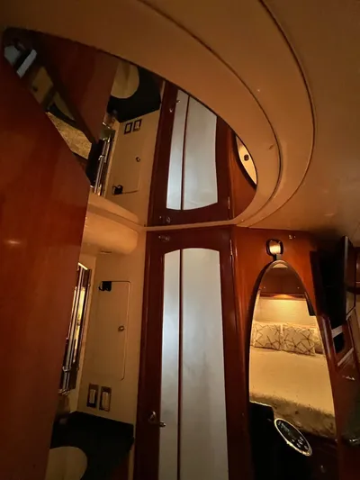  Yacht Photos Pics Interior of 2000 Carver 506 Motor Yacht with wood paneling and cozy bedroom.