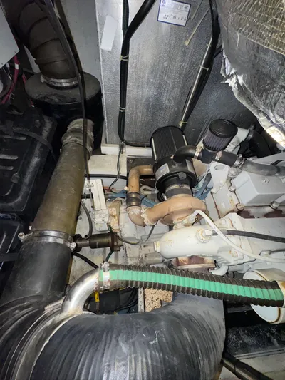  Yacht Photos Pics Engine room of a 2000 Carver 506 Motor Yacht, showcasing mechanical components and piping.