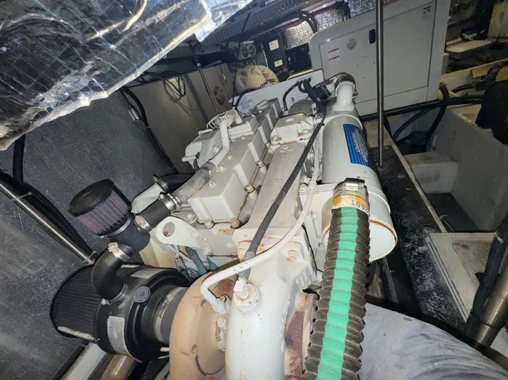  Yacht Photos Pics Engine room of 2000 Carver 506 Motor Yacht, showcasing mechanical components and systems.