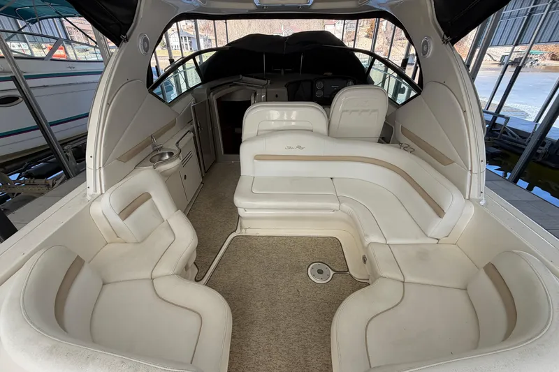  Yacht Photos Pics 2008 Sea Ray 38 Sundancer interior with white seating and helm, docked in a marina.