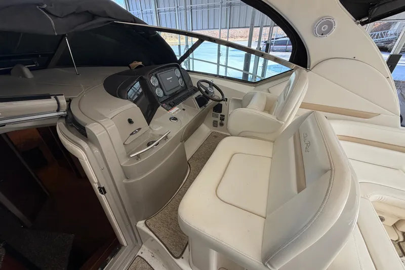  Yacht Photos Pics 2008 Sea Ray 38 Sundancer helm with white seating and modern dashboard controls.