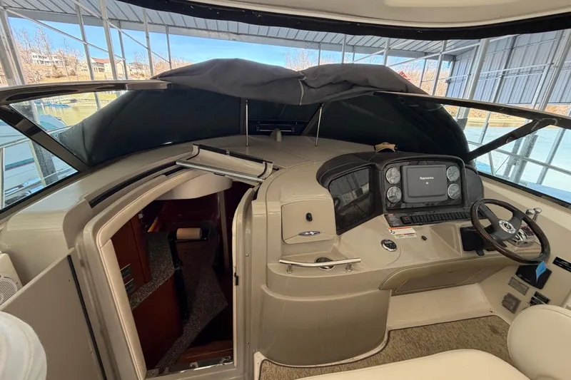  Yacht Photos Pics 2008 Sea Ray 38 Sundancer helm with navigation system and cabin entrance.