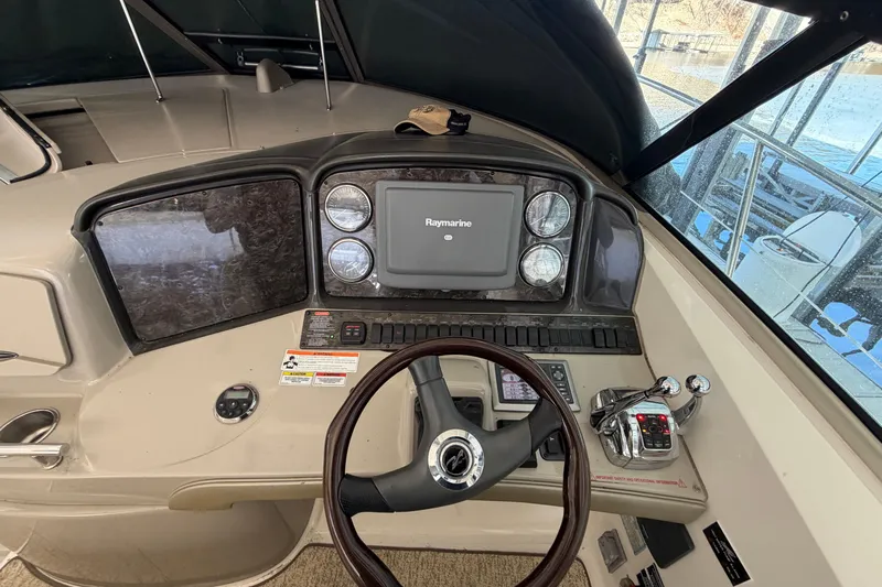  Yacht Photos Pics Helm of 2008 Sea Ray 38 Sundancer with Raymarine navigation system and controls.