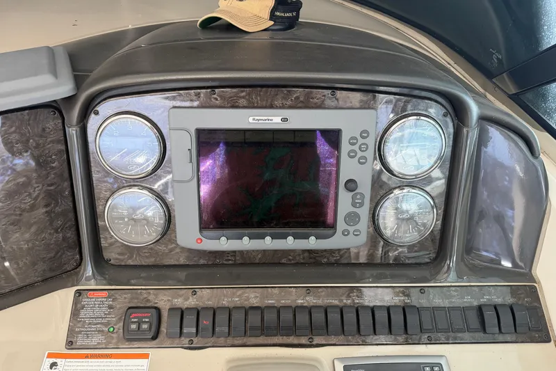  Yacht Photos Pics Control panel of a 2008 Sea Ray 38 Sundancer boat with gauges and Raymarine display.