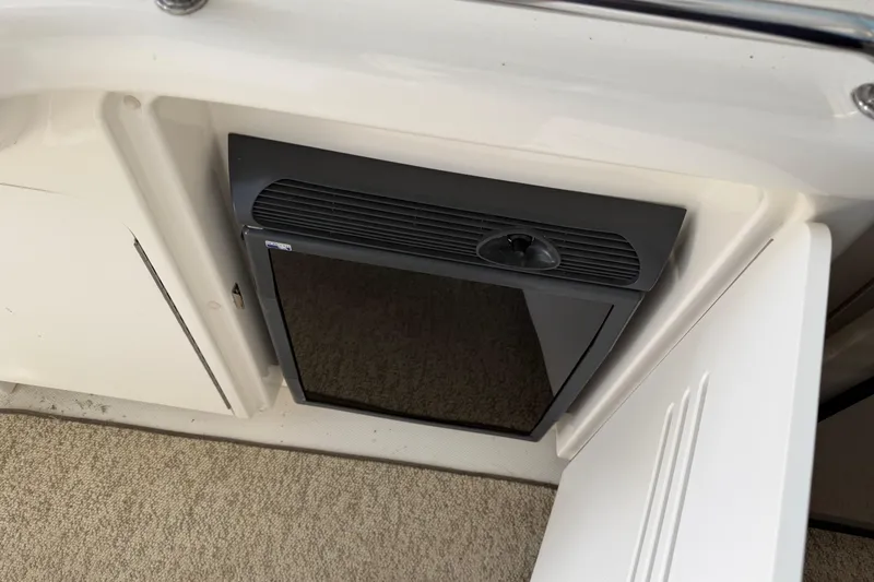  Yacht Photos Pics 2008 Sea Ray 38 Sundancer interior with built-in mini fridge and carpeted flooring.