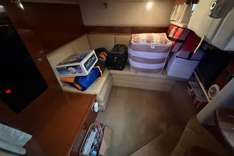  Yacht Photos Pics Interior cabin of 2008 Sea Ray 38 Sundancer with storage and seating area.