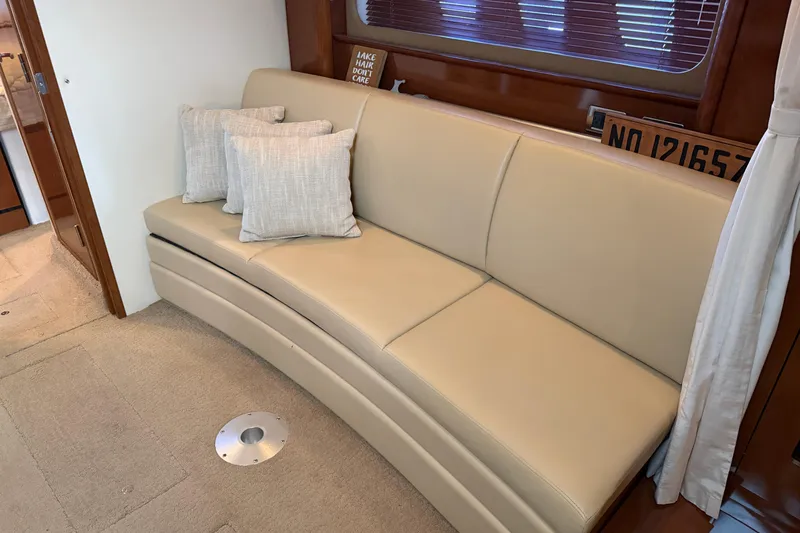  Yacht Photos Pics Interior of 2008 Sea Ray 38 Sundancer with beige leather sofa and decorative pillows.