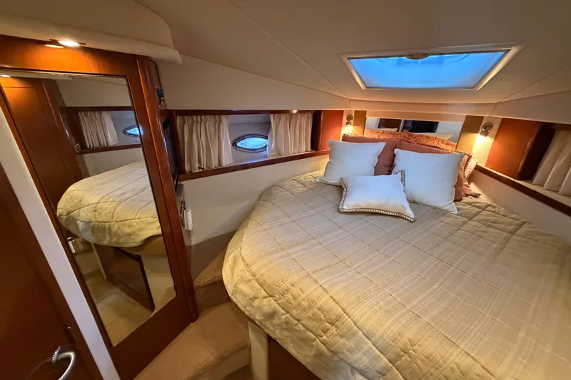  Yacht Photos Pics Luxurious cabin interior of 2008 Sea Ray 38 Sundancer yacht with cozy bedding.