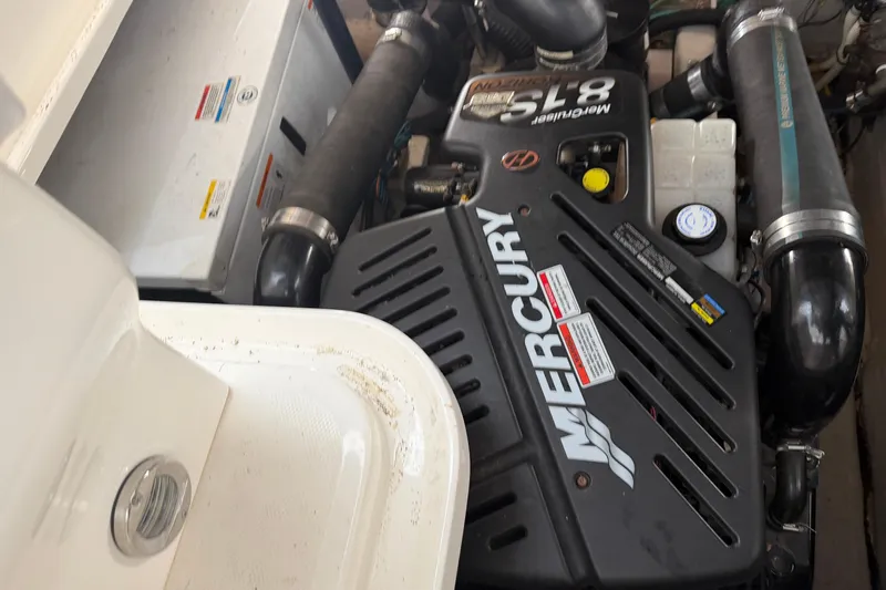  Yacht Photos Pics Engine compartment of 2008 Sea Ray 38 Sundancer with Mercury engine components visible.