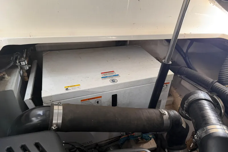  Yacht Photos Pics Engine compartment of a 2008 Sea Ray 38 Sundancer boat, showing mechanical components.