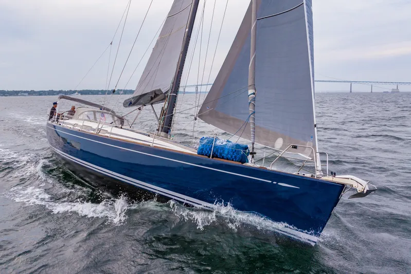 Nehalennia Yacht Photos Pics 2018 Nautor Swan 54 sailing yacht on open water with bridge in background.