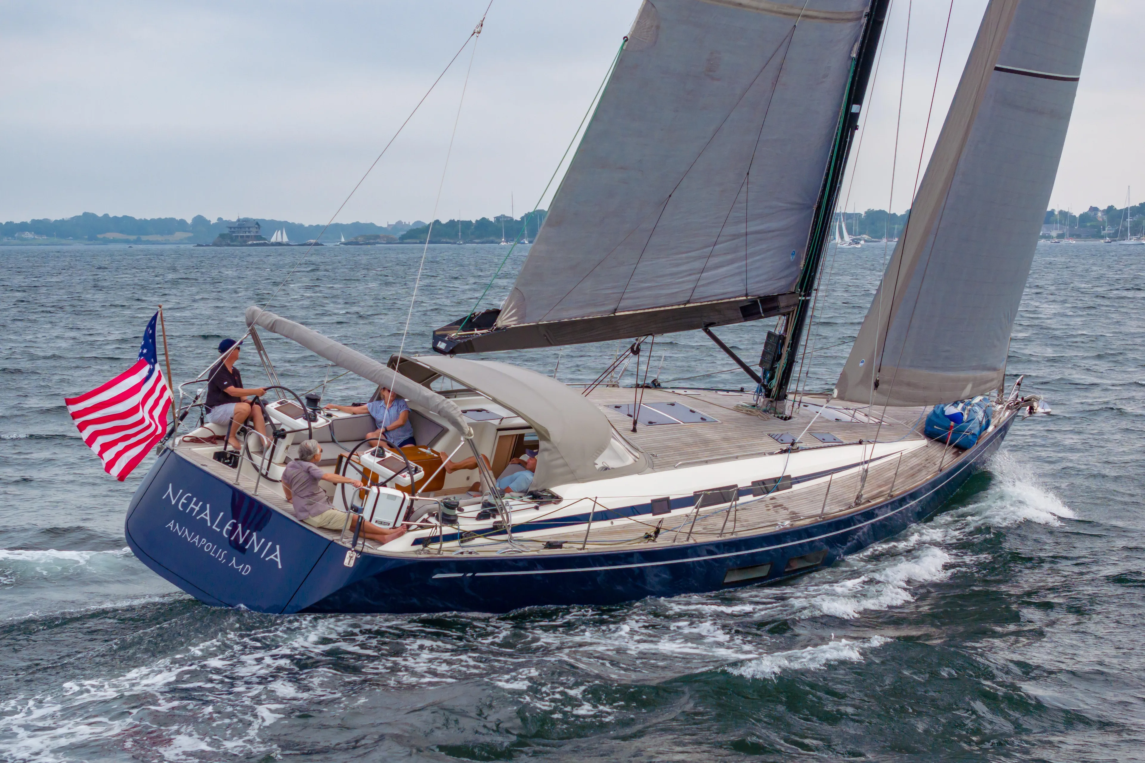 Nehalennia Yacht Photos Pics 2018 Nautor Swan 54 sailing yacht on open water with American flag.