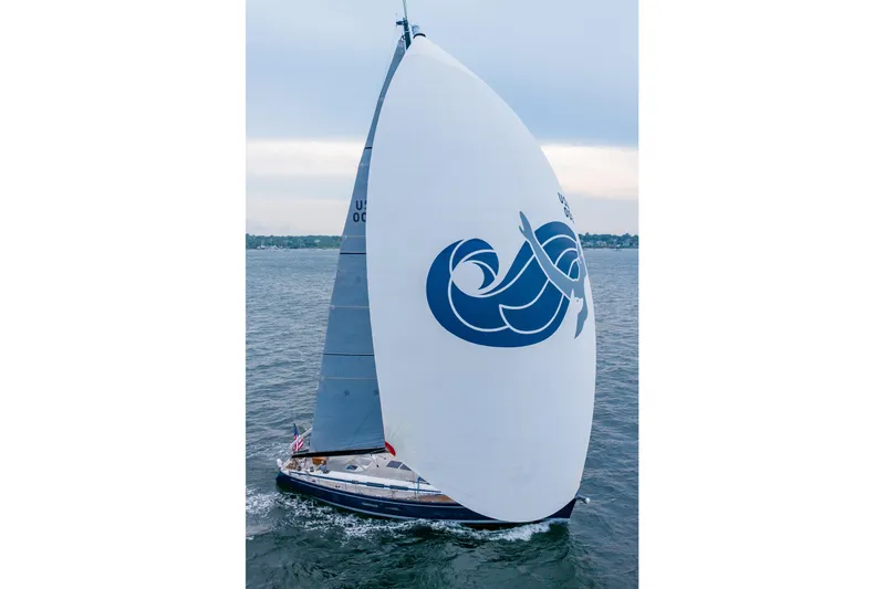 Nehalennia Yacht Photos Pics 2018 Nautor Swan 54 sailboat with large spinnaker on open water.