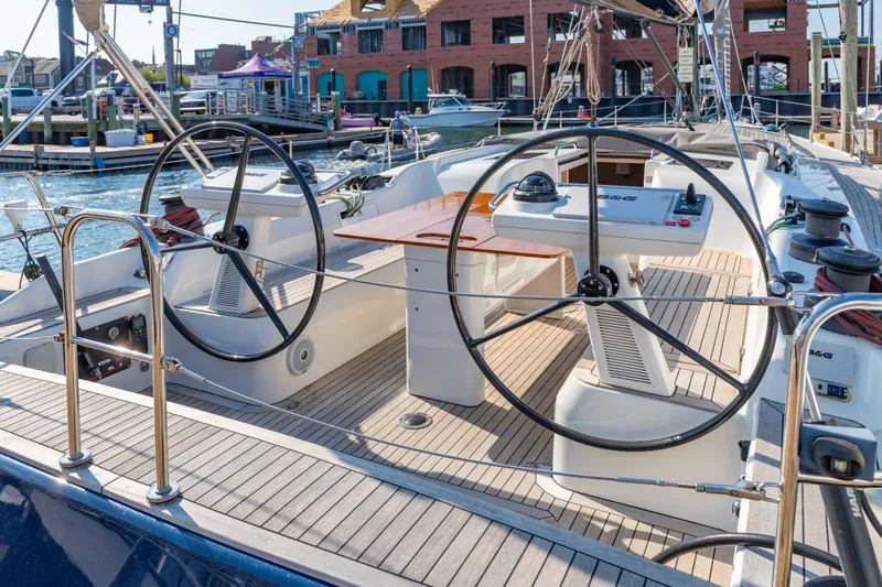 Nehalennia Yacht Photos Pics 2018 Nautor Swan 54 yacht cockpit with dual steering wheels and wooden deck.