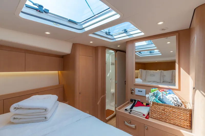 Nehalennia Yacht Photos Pics Luxurious cabin interior of 2018 Nautor Swan 54 yacht with skylights and modern amenities.
