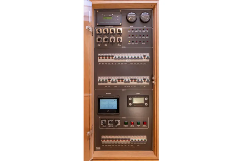 Nehalennia Yacht Photos Pics Electrical control panel of a 2018 Nautor Swan 54 yacht, featuring gauges and switches.