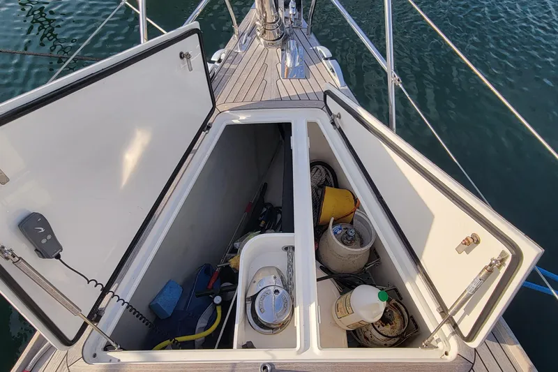 Nehalennia Yacht Photos Pics Open storage compartment on 2018 Nautor Swan 54 yacht, containing various boating supplies.