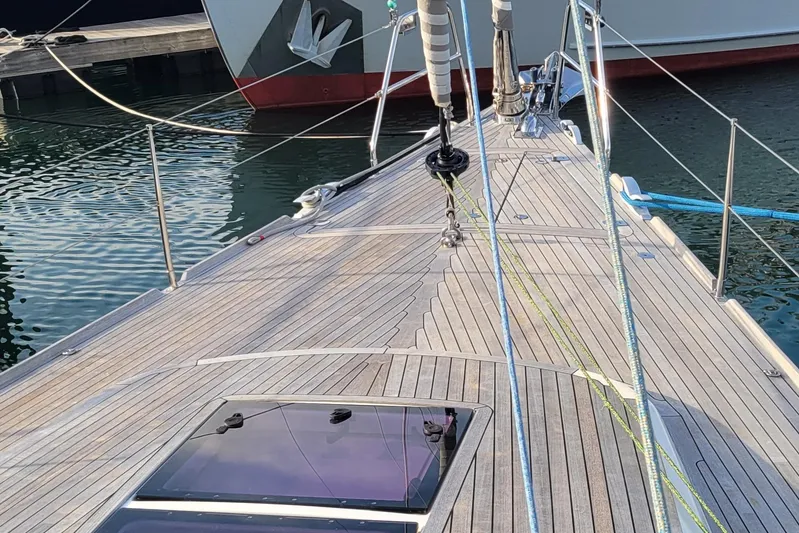 Nehalennia Yacht Photos Pics Deck view of 2018 Nautor Swan 54 yacht, featuring sleek wooden finish and rigging.