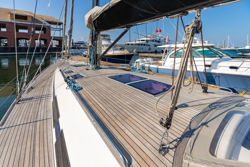 Nehalennia Yacht Photos Pics Sailing yacht Nautor Swan 54, 2018 model, docked at marina with wooden deck.
