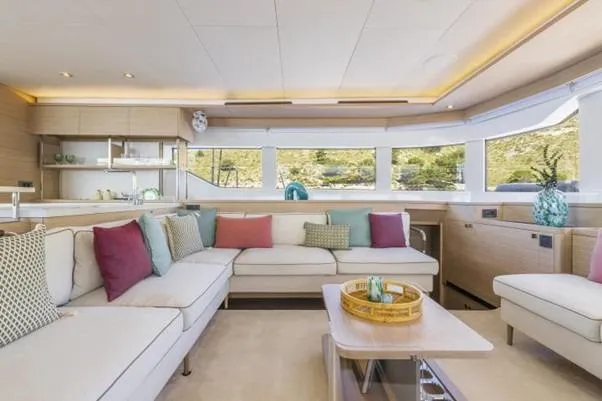  Yacht Photos Pics Luxurious interior of 2025 Lagoon 60 yacht with modern decor and comfortable seating.