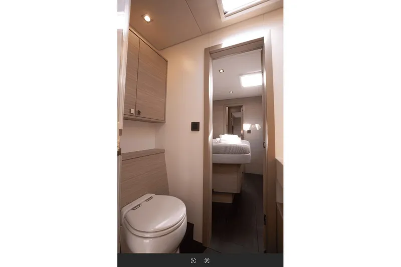  Yacht Photos Pics Interior of 2025 Lagoon 60 yacht, featuring modern bathroom and bedroom design.