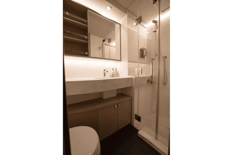  Yacht Photos Pics Modern bathroom in 2025 Lagoon 60 yacht with sleek shower and vanity.