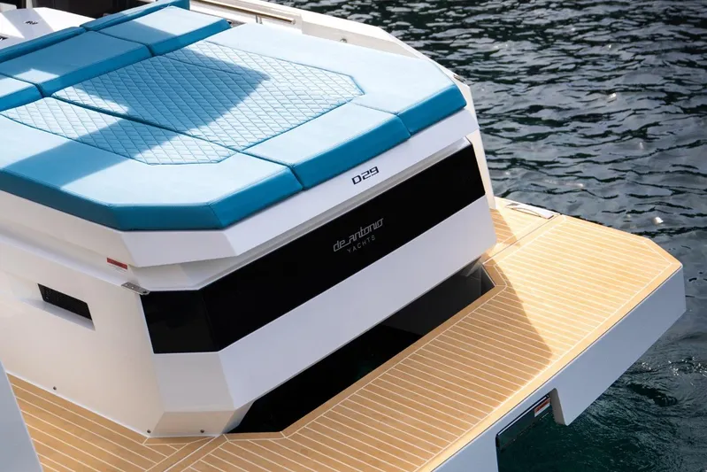  Yacht Photos Pics 2026 De Antonio Yachts D29 with blue sunbed and teak deck on water.