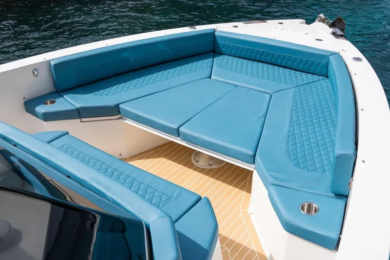  Yacht Photos Pics Luxurious seating on 2026 De Antonio Yachts D29, featuring blue upholstery and cup holders.