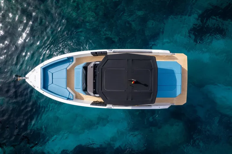  Yacht Photos Pics 2026 De Antonio Yachts D29, aerial view, sleek design, floating on clear blue water.