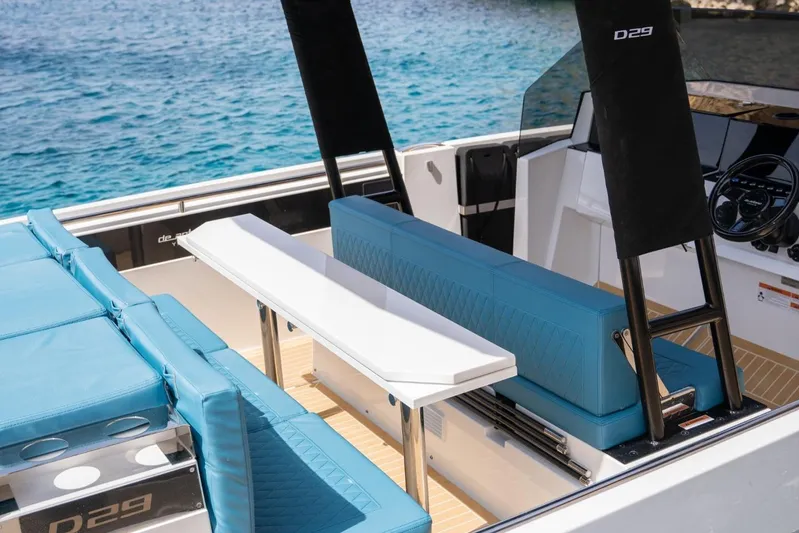  Yacht Photos Pics Luxurious 2026 De Antonio Yachts D29 interior with blue seating and sleek design.