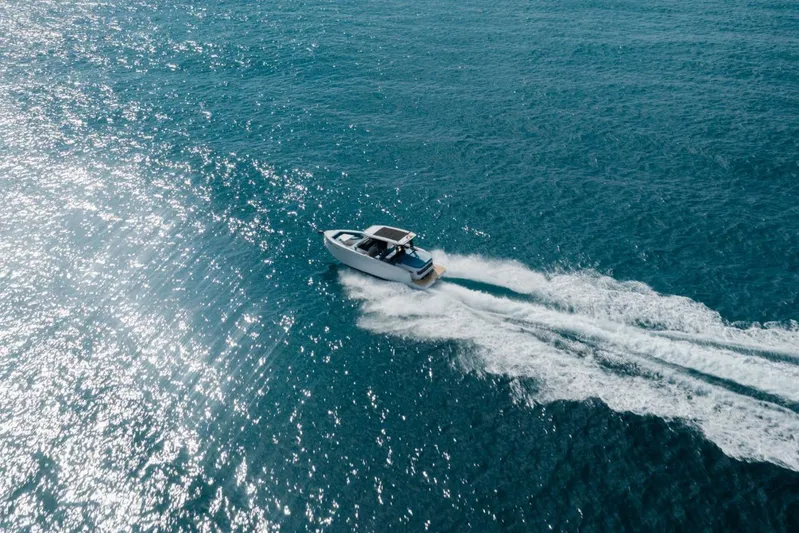  Yacht Photos Pics 2026 De Antonio Yachts D29 cruising on sparkling blue ocean waters.