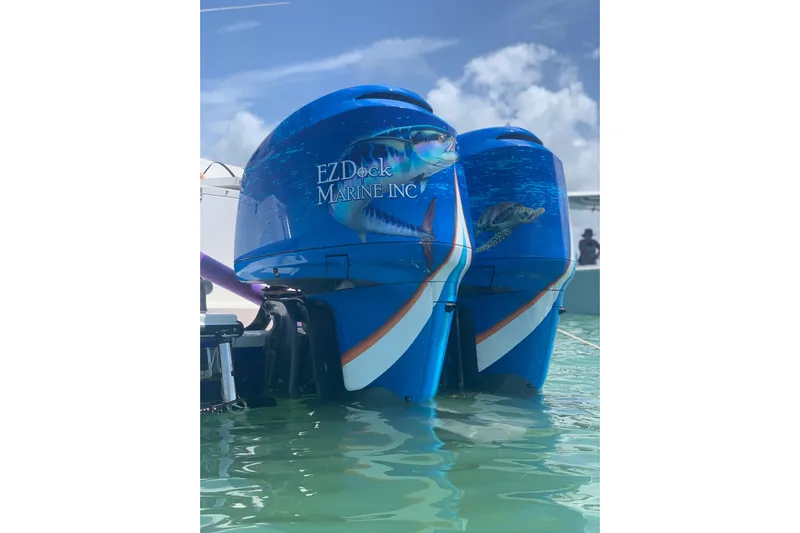  Yacht Photos Pics Twin outboard motors with marine graphics on a 2001 Regulator 32 Center Console boat.