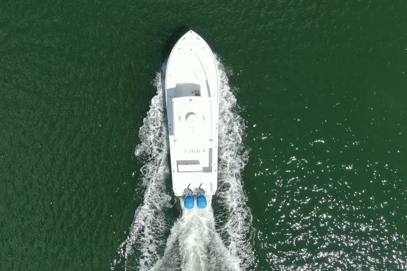  Yacht Photos Pics Aerial view of 2001 Regulator 32 Center Console boat cruising on water.